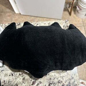 Bat shaped throw pillow